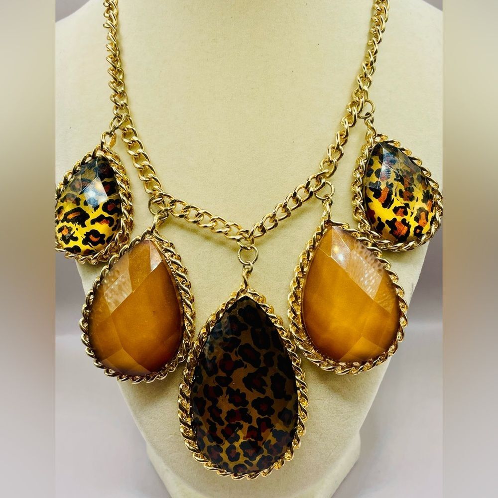 Animal print statement necklace with 5 lucite tear drop dangles. Gold tone. Glam